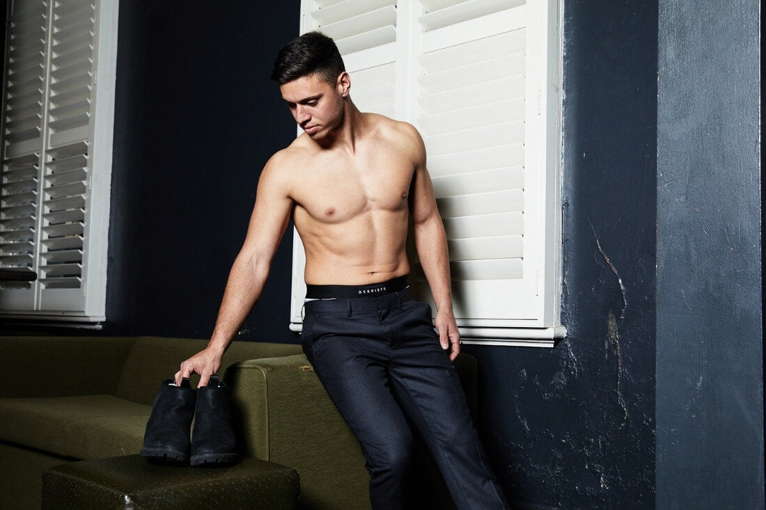 5 things to consider when searching for the perfect mens underwear - Man wearing black debriefs mens underwear getting dressed