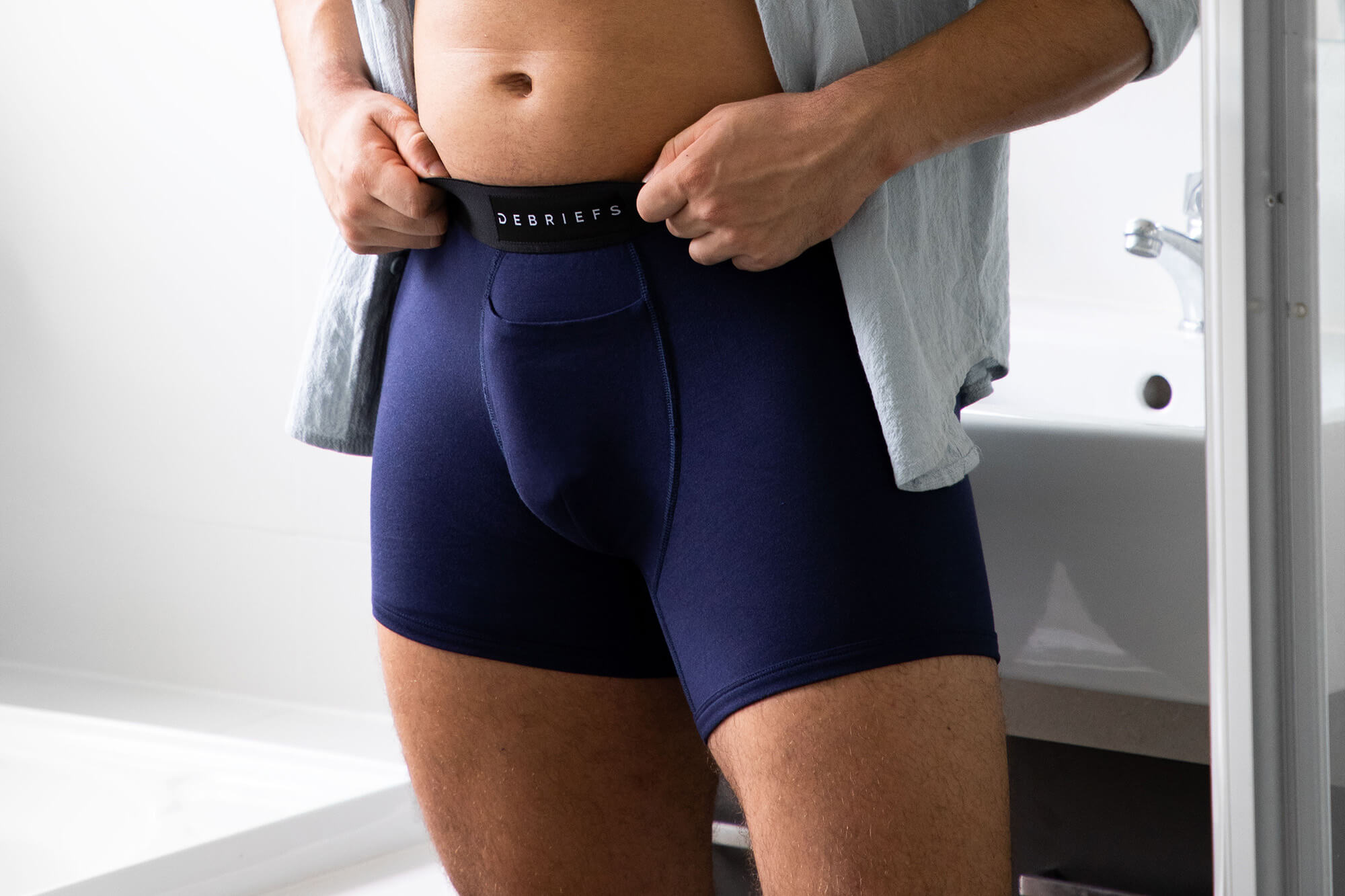 Man wearing Navy Debriefs boxer briefs for blog on boxer briefs explained. The why and when to wear boxer briefs men's underwear.