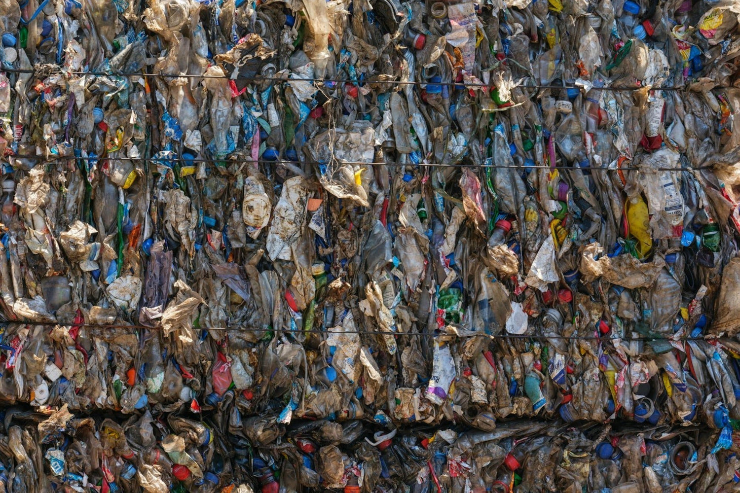 Clothes and underwear in landfill showing a hidden cost of cheap underwear