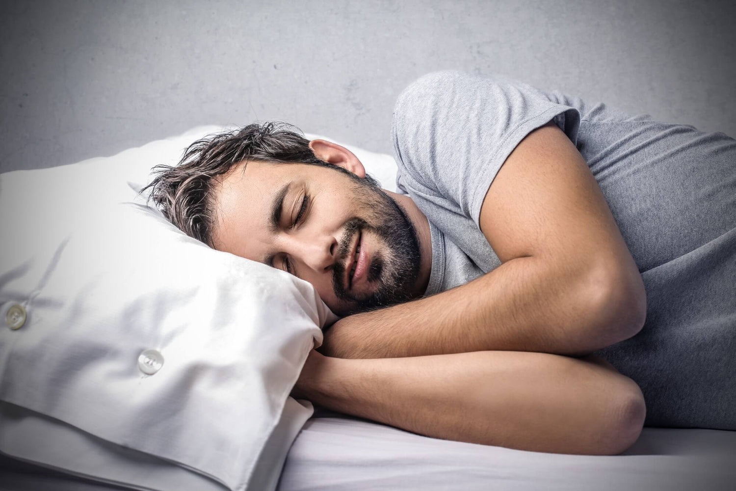 A man sleeping in his underwear for a blog on how underwear affects sleep quality